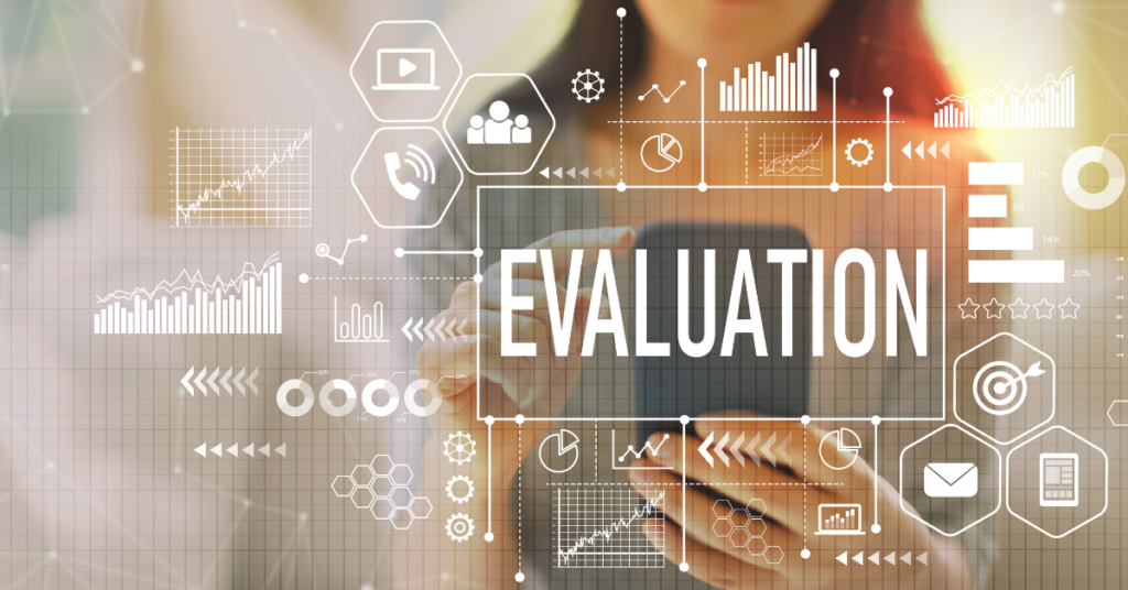 The word 'EVALUATION' surrounded by various illustrated icons implying informational communication and icons representing various kinds of charts and graphs. In the background and out of focus is a woman holding a smartphone device