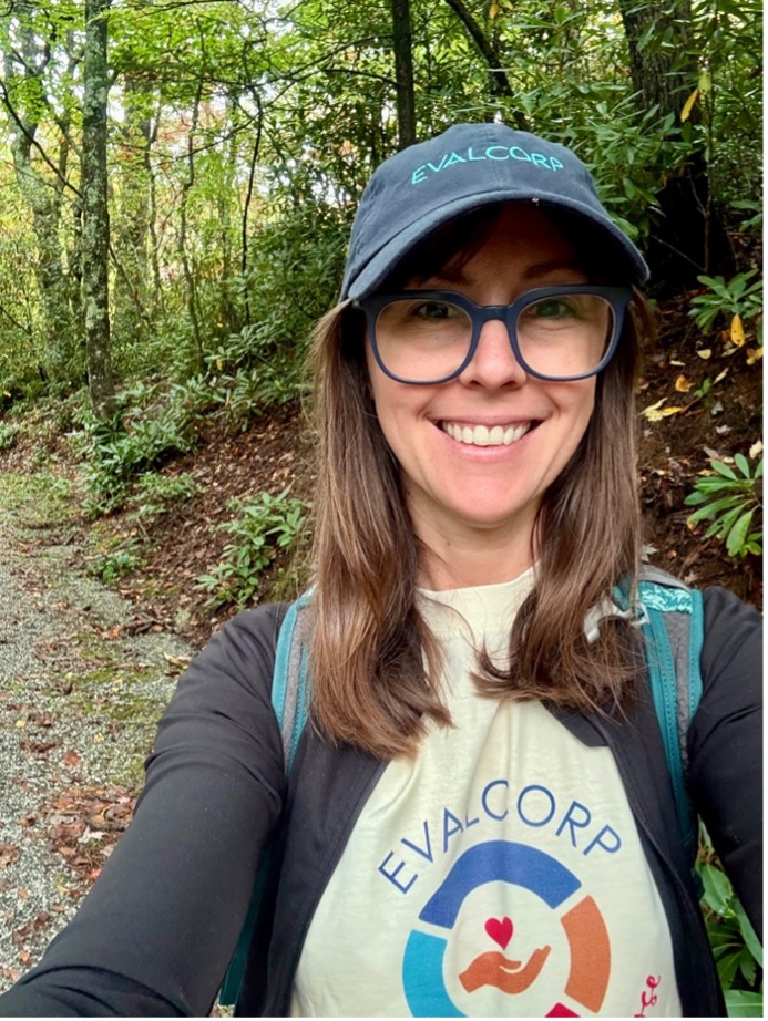 Image of team member in the woods volunteering as a citizen scientist.
