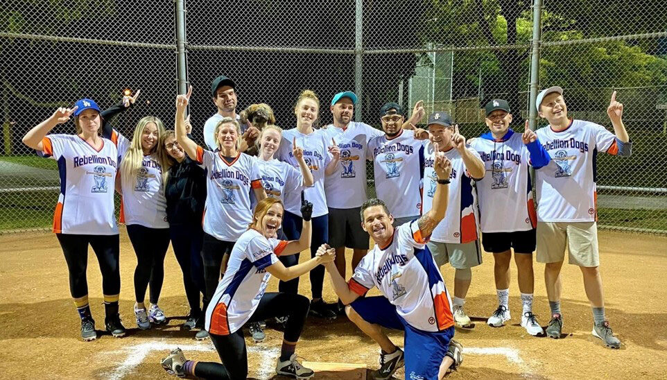 photograph of evalcorp's sponsored softball team Rebellion Dogs players