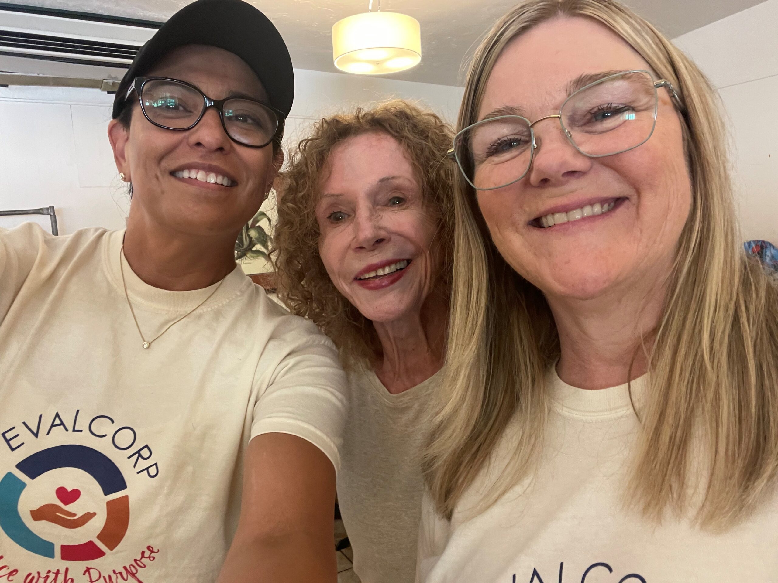 Lorena and Kristen smile with a fellow volunteer 