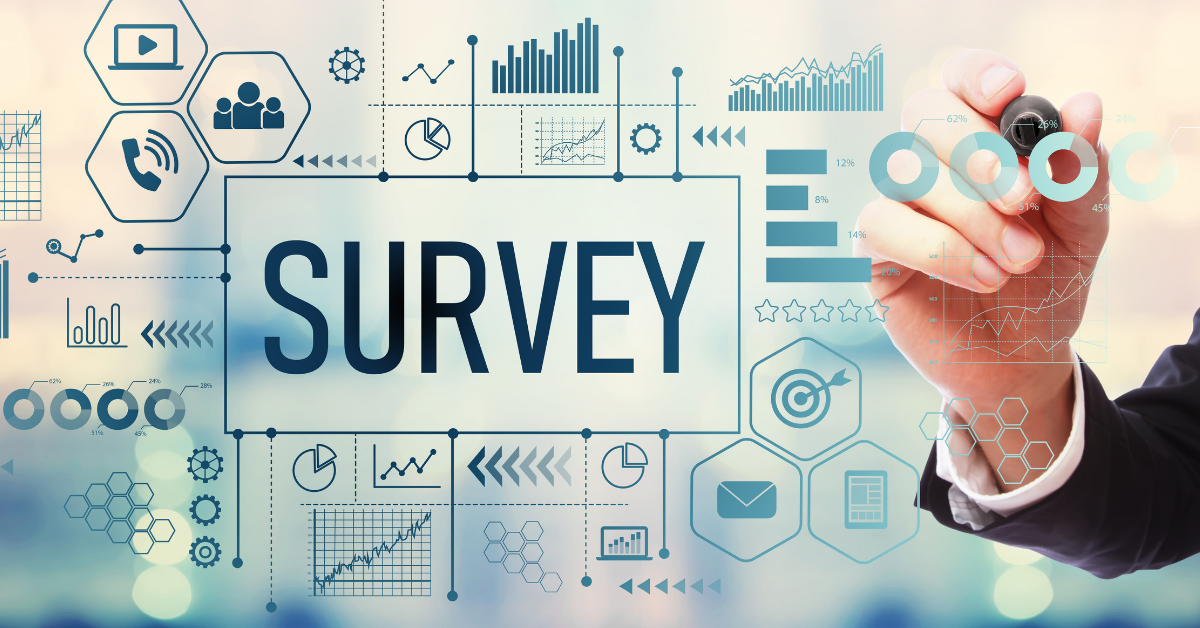 The word 'SURVEY' surrounded by various illustrated icons implying informational communication and icons representing various kinds of charts and graphs. In the background is a hand holding a marker
